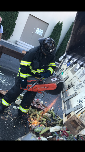 FF Peter Gospodinov overhauling the contents of a fully involved Truck Fire on I-95 on Sept. 23rd 2017